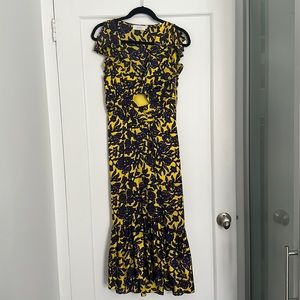 Silk dress with peephole and ruffle details